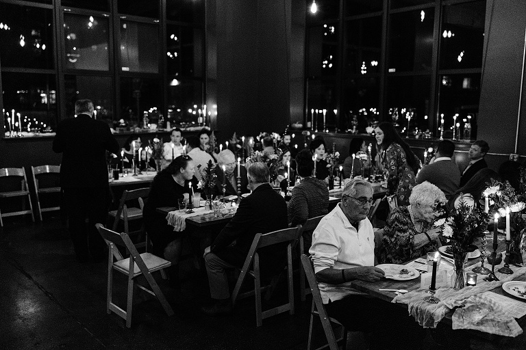 Black and White, wide shot: guests eat their meals at the restaurant