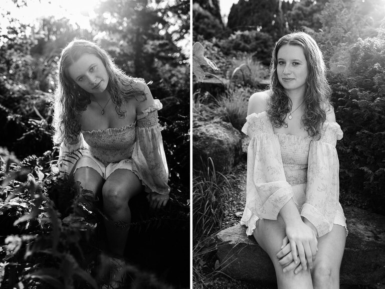 black and white. senior girl sits for senior pictures in nature